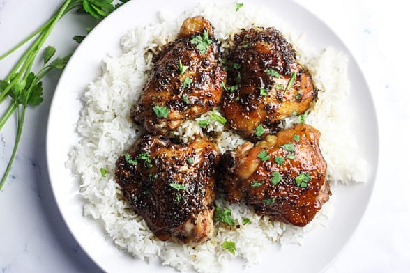 Jasmine rice topped with brown-sugar garlic chicken thighs.