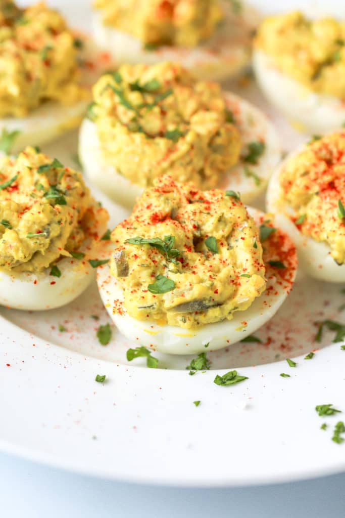 Southern Deviled Eggs on a plate find this Southern Deviled Egg recipe at eriqueberry.co.